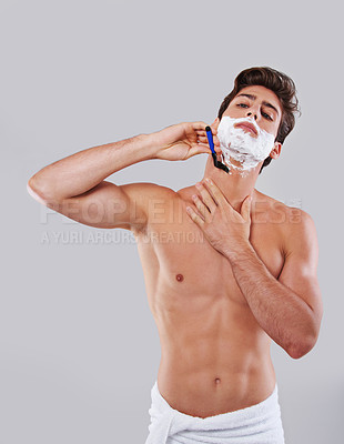 Buy stock photo Man, shave and cream with razor blade for grooming, hygiene or facial treatment on a gray studio background. Handsome and attractive male person or model with creme for skincare or beauty on mockup