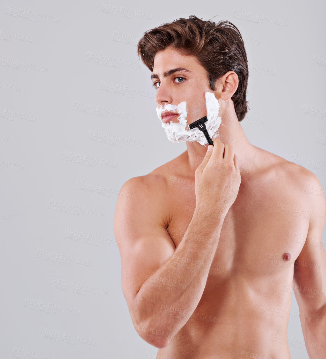 Buy stock photo Razor, shave and man on a white background for wellness, hair removal and beauty treatment in studio. Skincare, dermatology and isolated person with shaving cream for cosmetics, grooming and hygiene