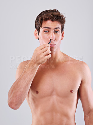 Buy stock photo Tweezer, nose and man on a white background for wellness, hair removal and facial treatment in studio. Skincare, dermatology and isolated person with beauty tools for cosmetics, grooming and hygiene