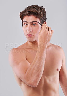 Buy stock photo Tweezer, eyebrow and portrait of man on gray background for wellness, hair removal and facial treatment in studio. Skincare, health and person with beauty tools for cosmetics, grooming and hygiene