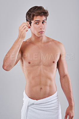 Buy stock photo Tweezer, health and man on gray background for wellness, hair removal and beauty treatment in studio. Skincare, dermatology and isolated person with beauty tools for cosmetics, grooming and hygiene