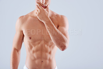 Buy stock photo Muscular man, body and fitness with abs in hygiene, health and wellness on a gray studio background. Closeup of male person or model in wonder with abdominal muscle, torso or strength on mockup space