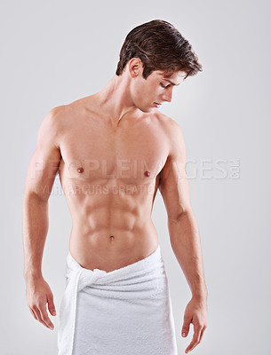 Buy stock photo Towel, shower and man on a white background for wellness, hygiene and cleaning for healthy skin. Skincare, bathroom and isolated person with confidence for grooming, self care and washing in studio