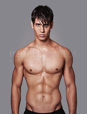 Buy stock photo A handsome young shirtless man posingPortrait of a handsome young shirtless man posing in the studioin studio