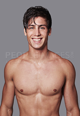 Buy stock photo Portrait of a handsome young shirtless man posing in the studio