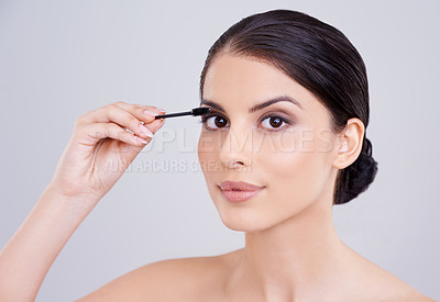 Buy stock photo Makeup, mascara and brush with woman in portrait, beauty for lashes and cosmetology on white background. Skin, glow and transformation for makeover, cosmetic product and wand for eyelash with volume