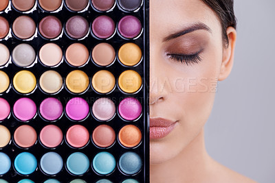 Buy stock photo Eyeshadow, portrait and woman in studio with makeup palette for cosmetics, powder and foundation on gray background. Closeup, beauty and model with cosmetology product, facial glow and skincare
