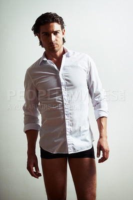 Buy stock photo Shirt, portrait or sexy man in studio with underwear, wellness or confidence on white background. Aesthetic adult, sensual person or handsome male model with fashion or serious face in Italy alone