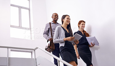 Buy stock photo Office building, stairs and business people walking with tablet, documents or planning for meeting brief. Corporate, coworking and creative team at startup with conversation, chat or communication