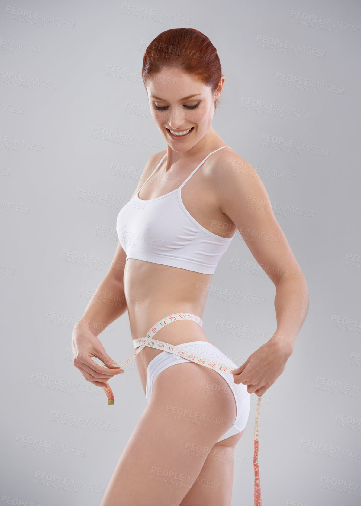 Buy stock photo Cropped shot of a sporty young woman in the studio