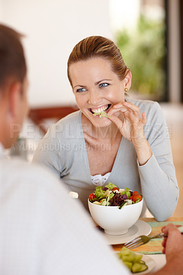 Buy stock photo Happy, woman and salad for eating, nutrition and food at restaurant, cafe and table for date with man. Female person, smile and girl with vegetables for health, wellness and clean diet with husband