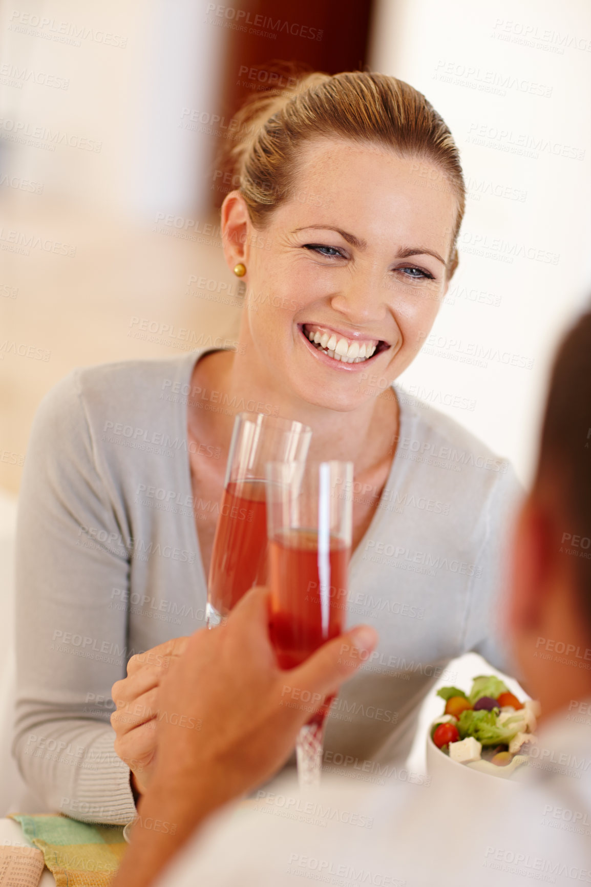 Buy stock photo Loving husband and wife bonding over wine and dinner together. Cheerful couple having a drink while eating supper together. Joyful boyfriend and girl toasting, celebrating their anniversary 