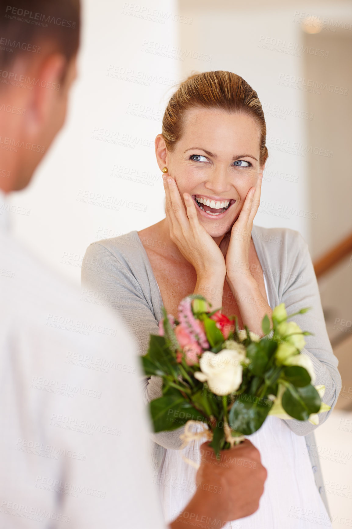 Buy stock photo Wow, happy and woman with flowers for wedding, marriage and love with man for bonding in background. Female person, girl and wife with husband for bouquet, union and partnership of couple together