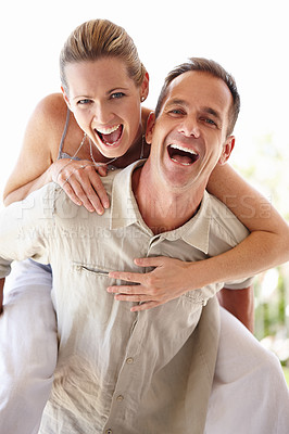 Buy stock photo Happy couple, portrait and piggyback with excited, fun and bonding at home for holiday or vacation. Funny man and woman laughing together, support and play games or energy with romance and care