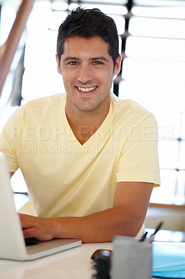 Buy stock photo Man, smile and portrait with laptop in office for internet, research online and website for company. Young person, editor and happy with tech for typing, email and creative project for work and job  