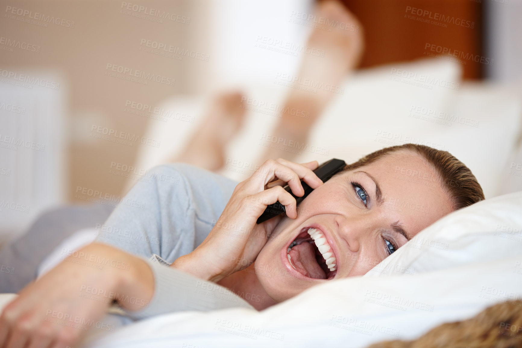 Buy stock photo Happy, woman laughing or phone call in home talking or speaking in living room for communication. Funny, mobile or person with smile in conversation to relax on couch or sofa in a house for a break 