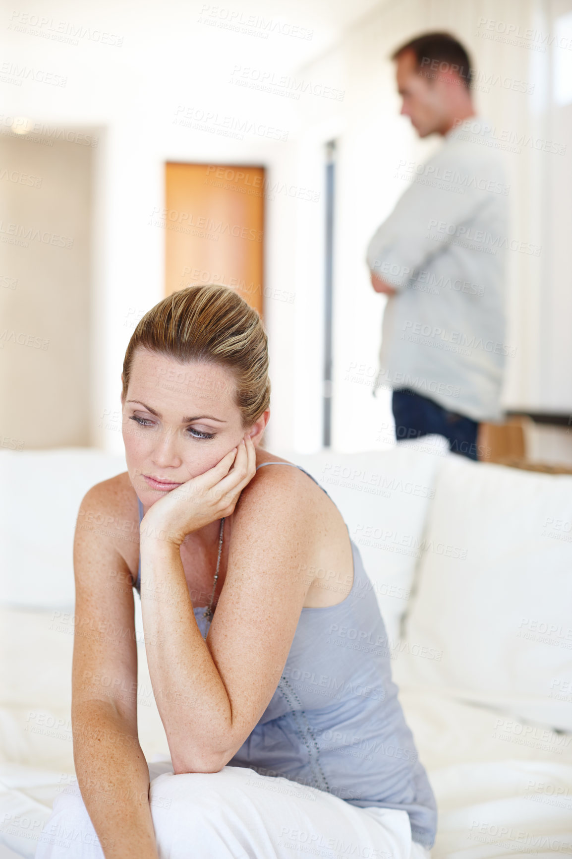 Buy stock photo Divorce, thinking and woman in home for conflict, crisis or fight in living room. Couple, breakup and sad people with depression, anger or frustrated with stress in argument for marriage fail on sofa