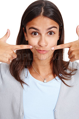 Buy stock photo Portrait, mouth or pointing and a woman in studio isolated on a white background with a smile gesture. Face, happy and point with an attractive young female posing on blank space feeling positive