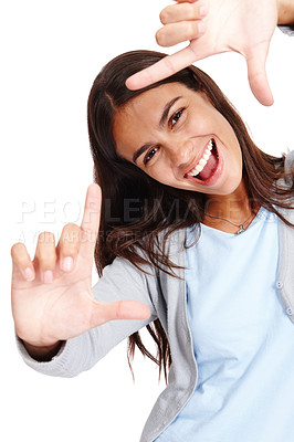 Buy stock photo Woman face, portrait and hands framing of a model smile with happiness and white background. Isolated, young person and hand frame of a happy female laughing and having fun in a studio alone