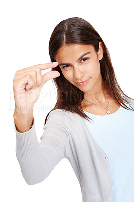 Buy stock photo Woman, portrait and fingers for advertising size, space and small mockup with a smile in studio. Female model in studio showing hand or sign for scale, inch or symbol isolated on a white background