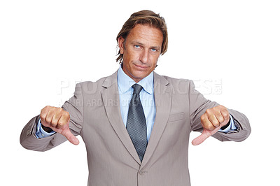 Buy stock photo Businessman, thumbs down and upset in disappointment for failure against a white studio background. Portrait of a isolated business man pointing down thumbs in disapproval, wrong or incorrect gesture