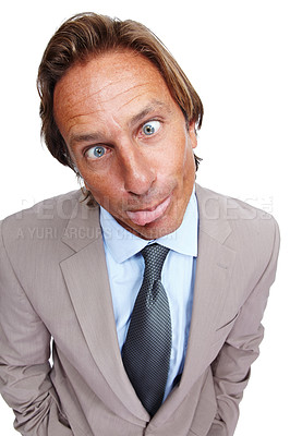 Buy stock photo Funny, comic and portrait of a business man with a silly face and a suit with white background. Crazy, joke and comedy of a model executive isolated with funny face and humor being goofy for work