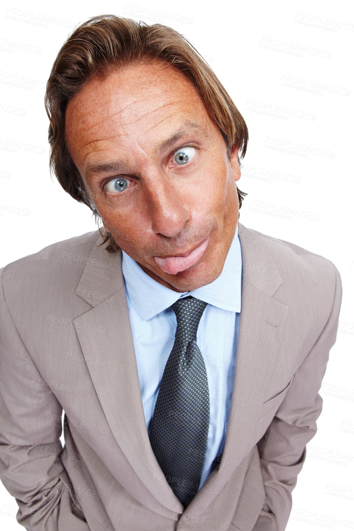 Buy stock photo Funny, comic and portrait of a business man with a silly face and a suit with white background. Crazy, joke and comedy of a model executive isolated with funny face and humor being goofy for work