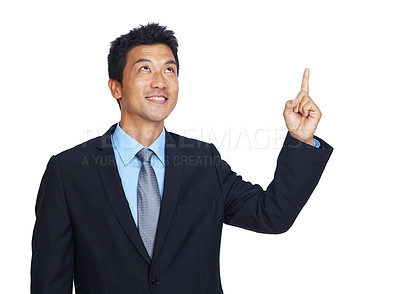 Buy stock photo Mockup, pointing and idea with a business asian man in studio isolated on a white background for growth. Marketing, thinking and point with a male employee showing empty mock up on blank space