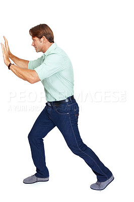 Buy stock photo Man, pushing and obstacle or wall with struggle against a white studio background. Isolated casual male walking to push heavy weight or shield using physical effort with expression or gesture