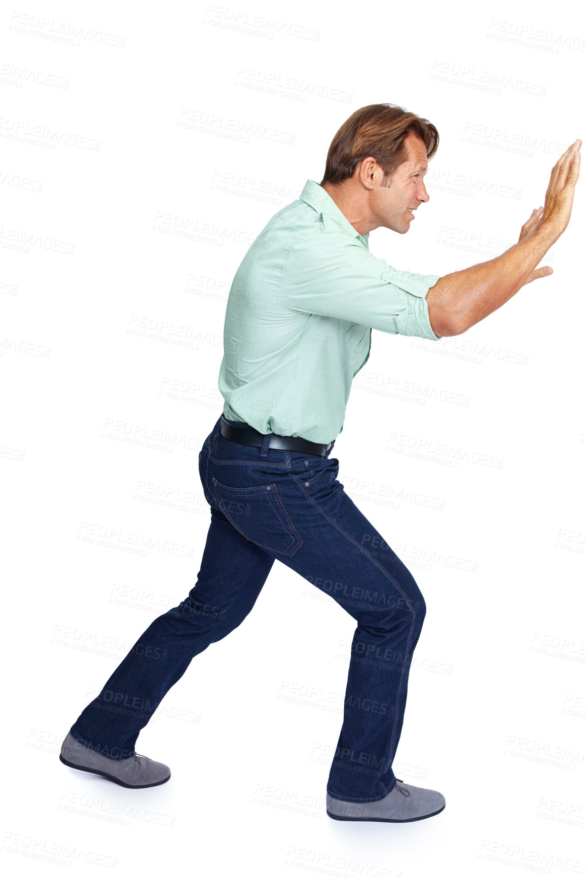 Buy stock photo Man, pushing and obstacle or frame in struggle against a white studio background. Isolated casual male walking to push heavy weight or shield using physical effort with expression or gesture