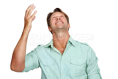 Buy stock photo Thank you, happy and man in studio, smile and celebrating victory while looking up on white background. Hand, success and young male in prayer for successful, winner or achievement while isolated