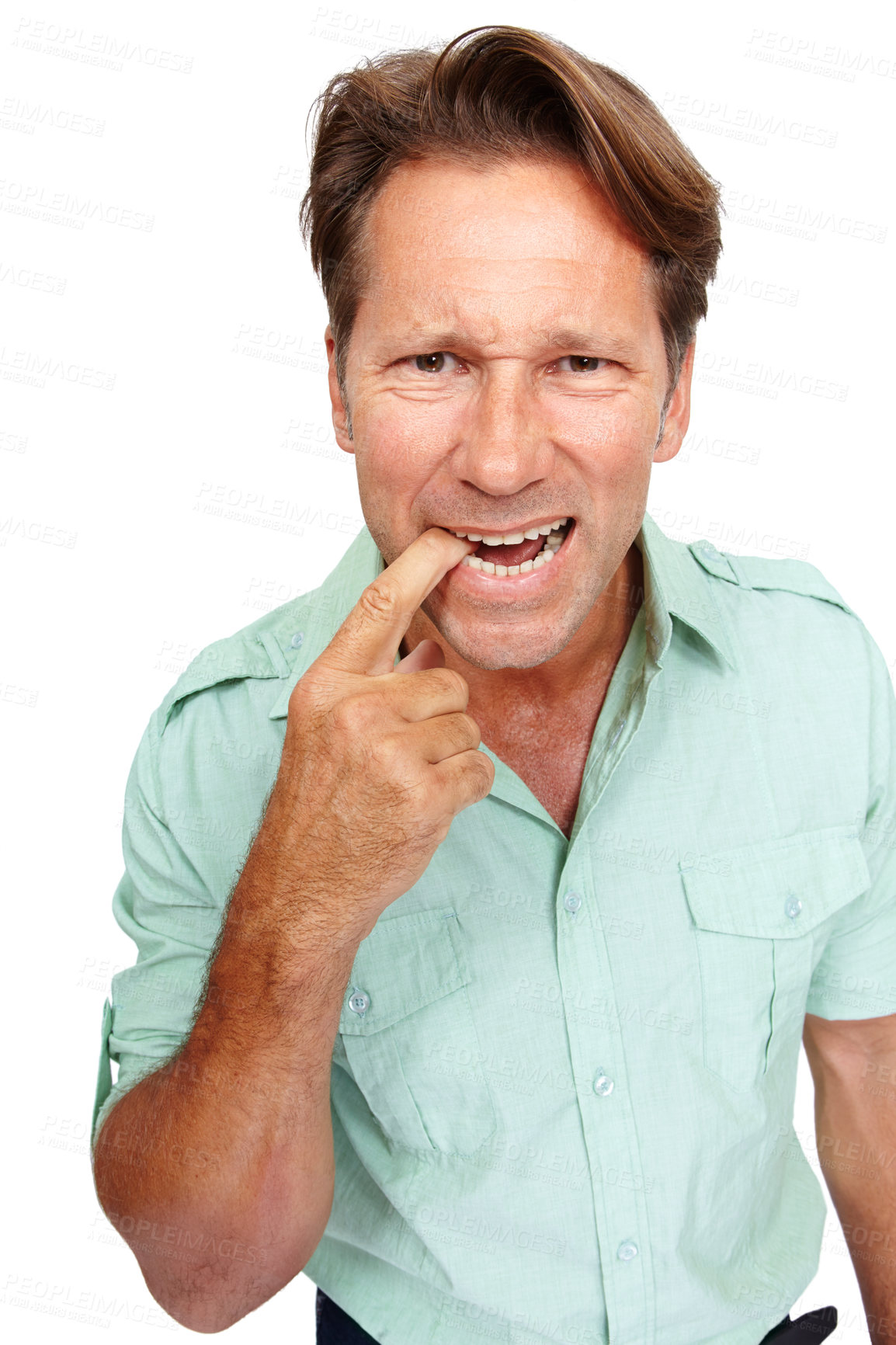 Buy stock photo Portrait of a man biting his finger in studio with a nervous, worried or terrified facial expression. Crazy, worry and uncertain mature male model with a fear gesture isolated by a white background.