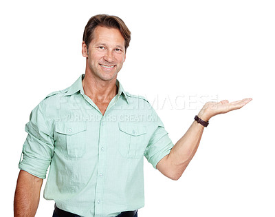 Buy stock photo Business, portrait of man with hand out with smile, product placement and mockup isolated on white background. Marketing, advertising and product announcement or presentation, businessman in studio.