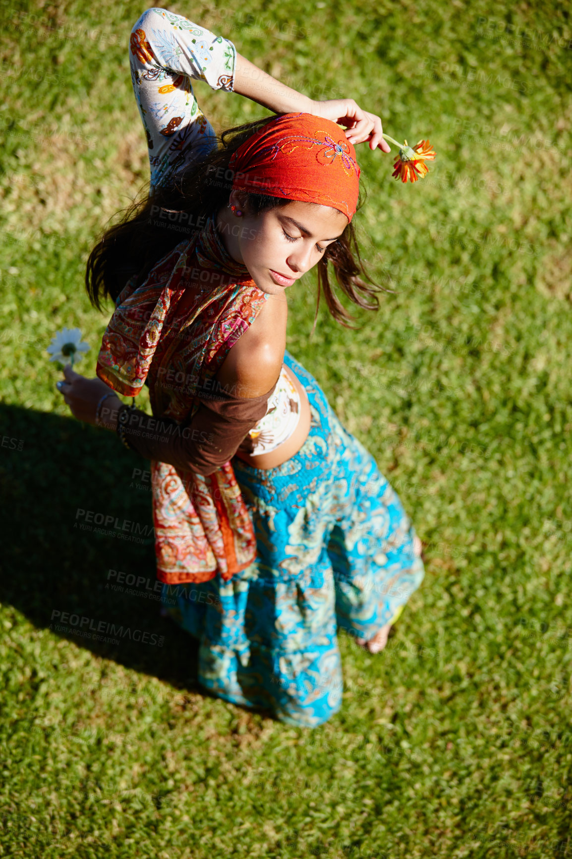 Buy stock photo Outdoor, bohemian and woman in nature, dancing and clothes with aesthetic of fashion and above. Peace, female person and girl with flower in field, summer and fabric of outfit for artist for culture