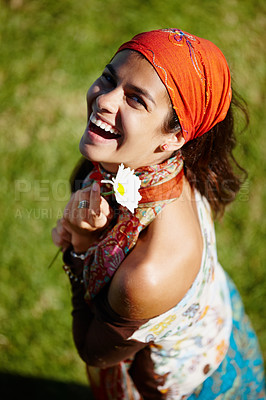 Buy stock photo Bohemian, portrait and woman in nature, smile and clothes with aesthetic of fashion and above. Peace, female person and girl with flower in field, summer and fabric of outfit for artist for culture