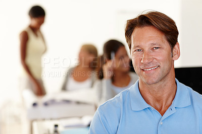 Buy stock photo Employee, portrait and smile on face in workplace with staff for corporate, small business or startup enterprise. Man, relaxed and happy colleagues working for company, entrepreneur or manager 