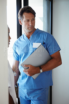 Buy stock photo Man, nurse and documents for hospital healthcare or medical insurance for diagnosis, paperwork or scrubs. Male person, planning and research folder or professional career, workplace or administration