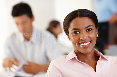 Buy stock photo Shot of a professional african woman smiling in an office environment