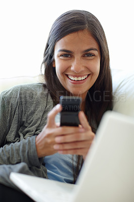 Buy stock photo Portrait, cellphone and laptop for female person, texting and couch at home for relax. Technology, social media and computer or streaming or online, mobile networking or communication on sofa