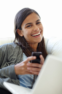 Buy stock photo Student, portrait or happy with cellphone on couch for break, text or update on social media in home. Indian woman, smile or face by smartphone on laptop, technology or connection for online research