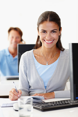 Buy stock photo Portrait, business secretary and happy woman writing notes in creative startup office at desk for coworking. Face, smile and professional receptionist with book, entrepreneur or employee by computer