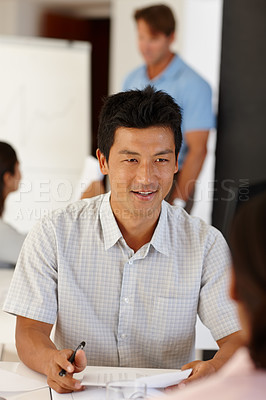 Buy stock photo Meeting, recruitment or Asian man in job interview with documents in office talking in negotiation. Explain, manager or person speaking to hr for hiring opportunity in discussion with business people