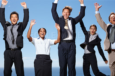 Buy stock photo Shot of a group of business people jumping in the air in excitement