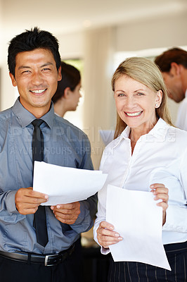 Buy stock photo Business people, portrait and diversity in office with paperwork and happy together in solidarity. HR consultant, asian man and mature woman for collaboration in recruitment and multicultural policy
