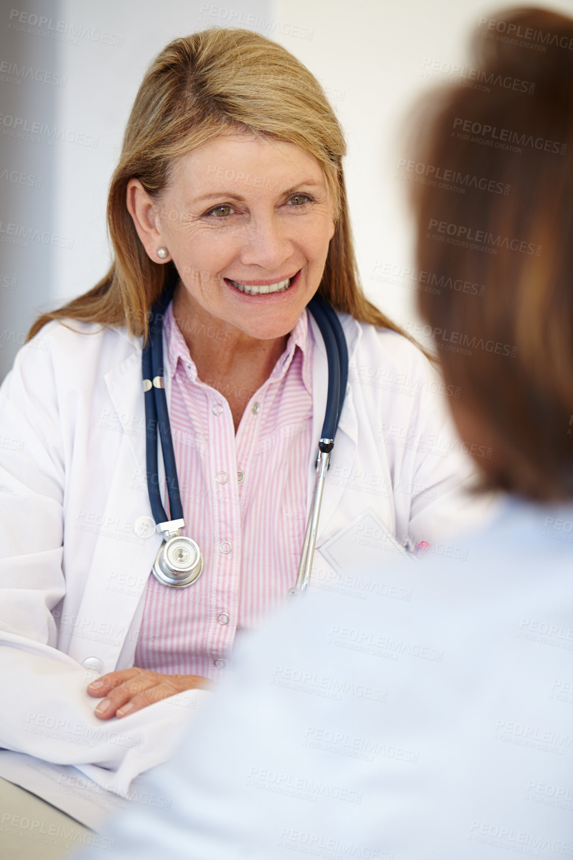 Buy stock photo Portrait of a mature female doctor having a conversation