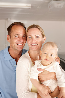 Buy stock photo Couple, baby and portrait with home, family love and smile or happiness for domestic. Father, mother and kid in house, garage and car for travel with parenting relationship and childhood bonding