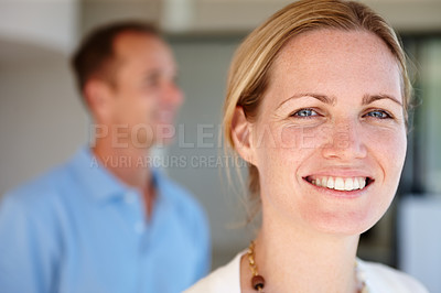 Buy stock photo Portrait, female and standing with spouse in house for positive getaway break together for bonding time as homeowners. Happy, couple and apartment for weekend in living room with blurred background