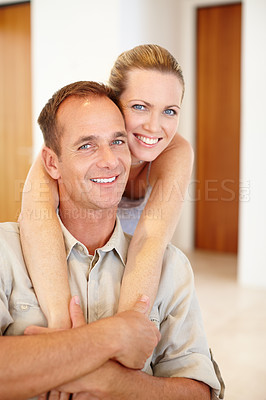 Buy stock photo Smile, portrait and couple in hug for comfort, love and proud of marriage or relax in home. Happy, embrace and mature people for relationship commitment, romance and bonding in apartment for care