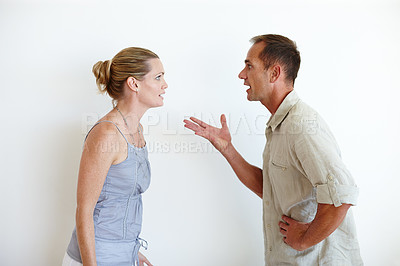 Buy stock photo Divorce, couple and fight in studio for crisis, stress or conflict isolated on a white background mockup space. Man, woman and argument for breakup, anger and frustrated for marriage fail together