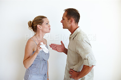 Buy stock photo Divorce, couple and fight in studio for conflict, stress or crisis isolated on a white background mockup space. Man, woman and argument for breakup, anger and frustrated at marriage fail with tissue